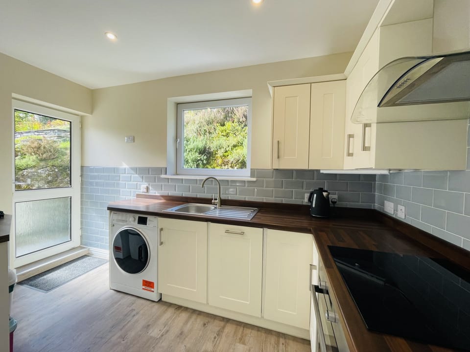 From the kitchen you can access the back garden and patio area