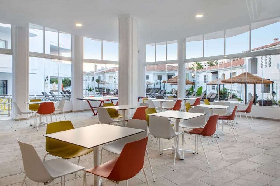 Bright and modern café area with stylish seating, perfect for a morning coffee or a casual meet-up.