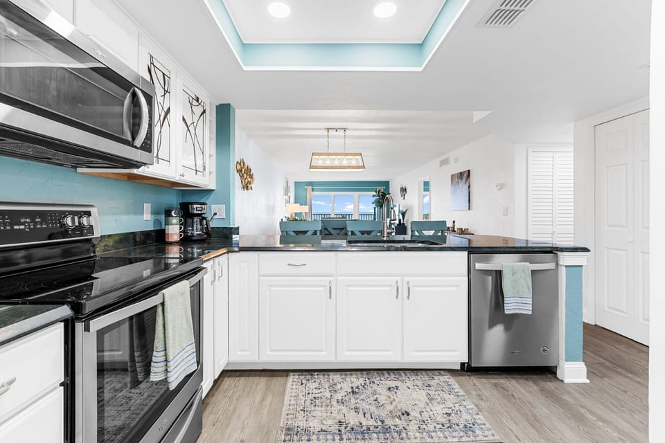 Beautifully renovated kitchen with modern appliances and coastal charm.
