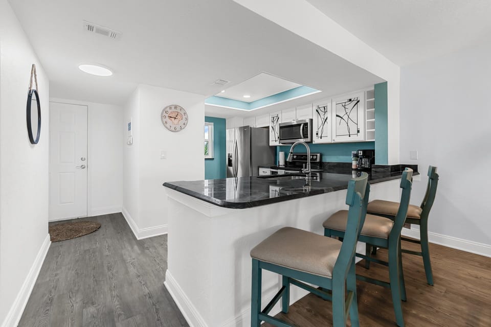 Breakfast bar in the kitchen with additional seating.