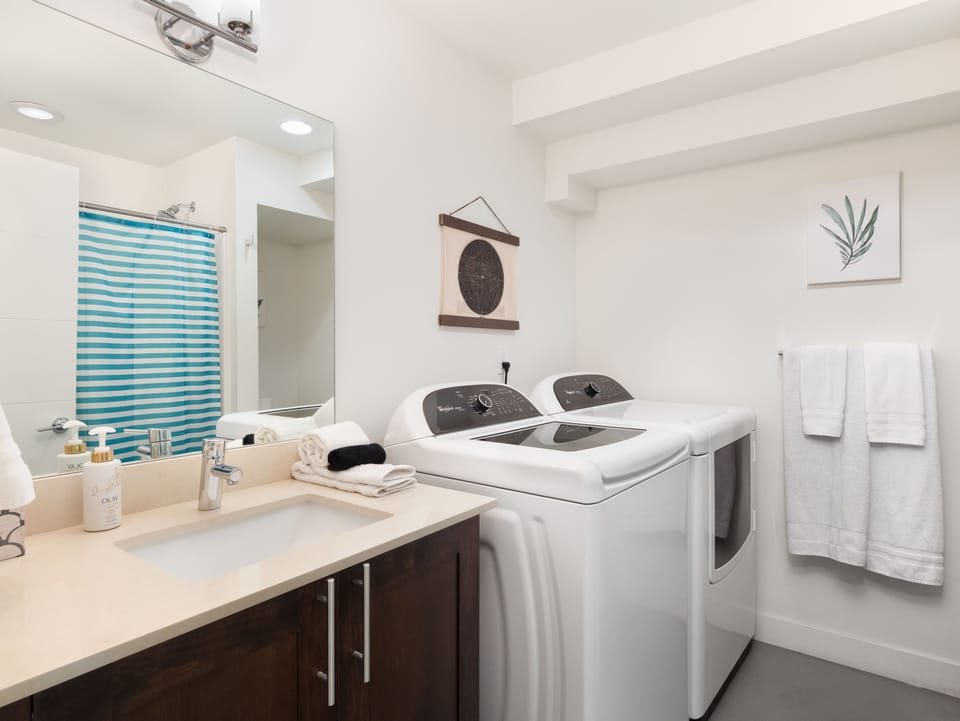 Second full bathroom with washer and dryer.