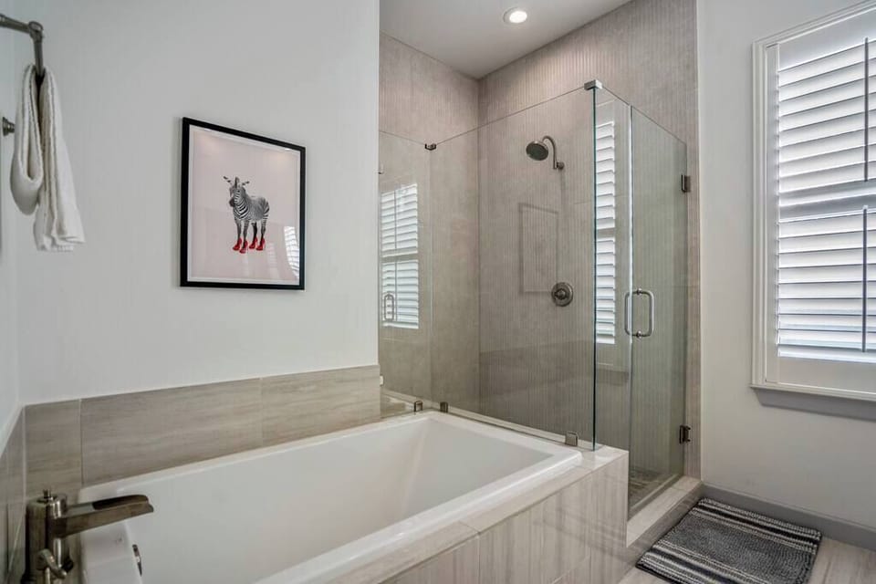 Master bath with large tub and shower.