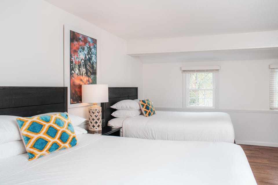 Deluxe Room, 2 Queen Beds | Down comforters, desk, laptop workspace, iron/ironing board