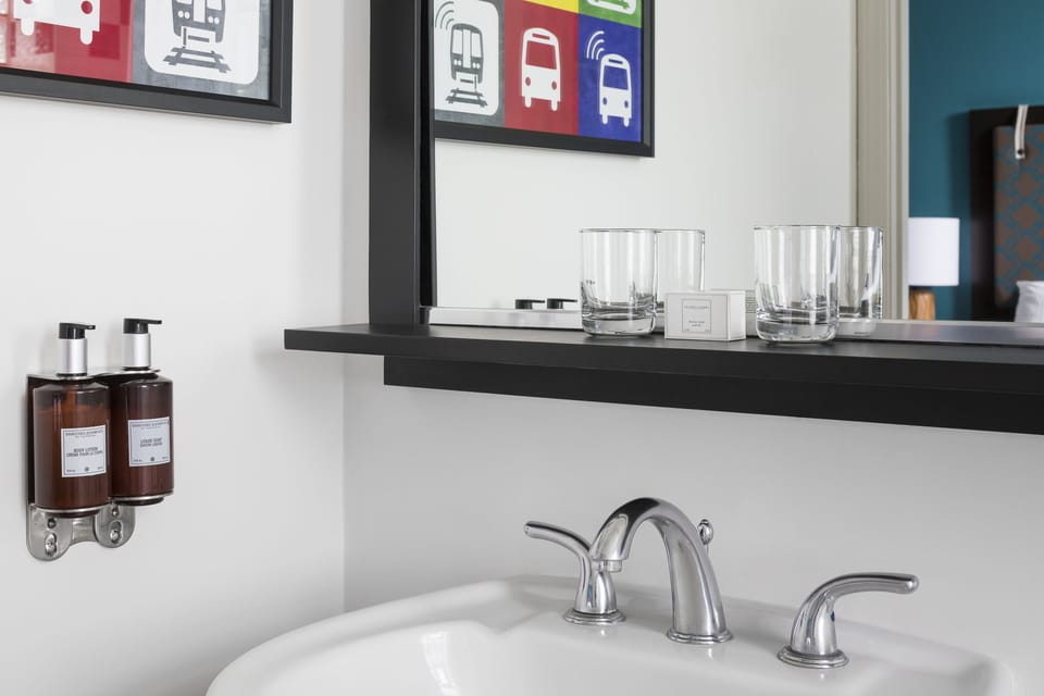 Bathtub, designer toiletries, hair dryer, bathrobes
