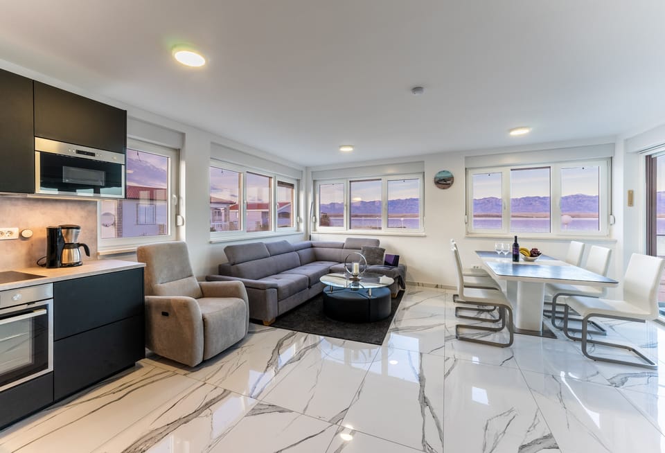 Family Apartment A1 | Living area | 100-cm flat-screen TV with satellite channels, TV