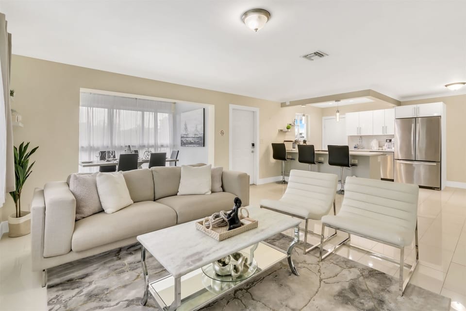 Cozy living room extends two sofas w/ numerous throw pillows
