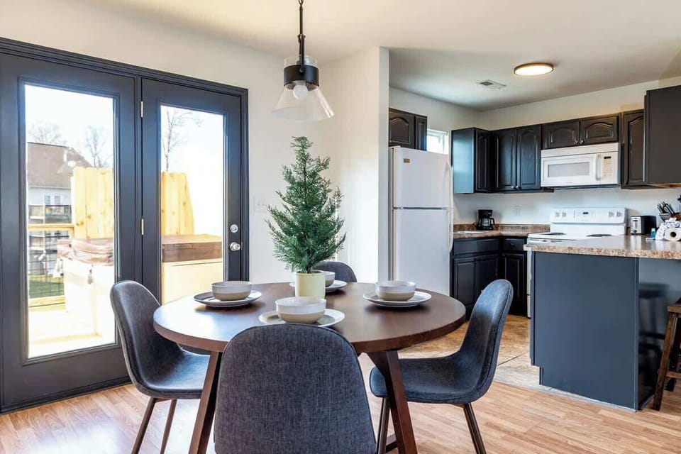 The dining table is ready for gatherings, Just steps away from the balcony and our cozy hot tub. Here’s to good food and great company!