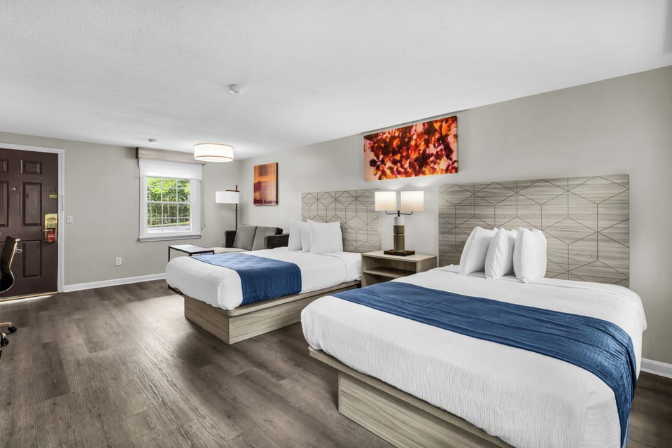 Executive Double Room | Blackout drapes, iron/ironing board, WiFi (free), individually decorated
