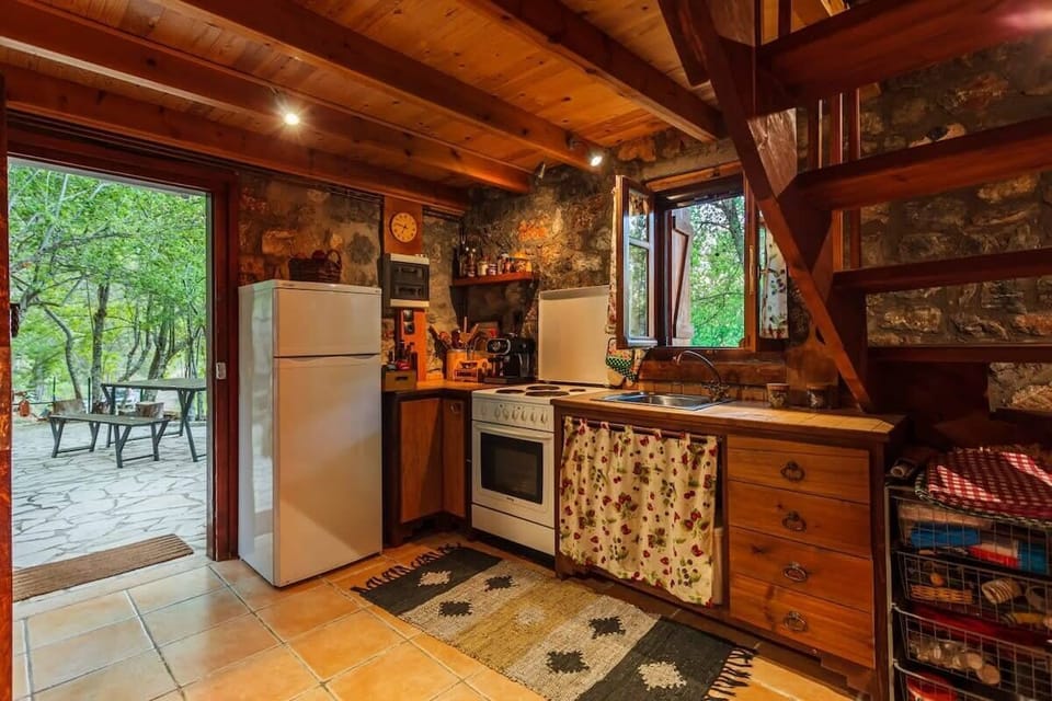 Enjoy preparing meals with scenic forest views.