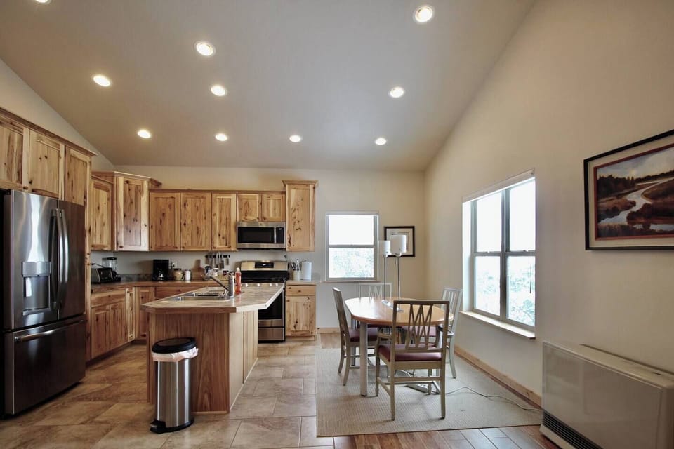 As you prepare meals, enjoy the warmth provided by the heating system near dining table, ensuring a cozy atmosphere throughout.