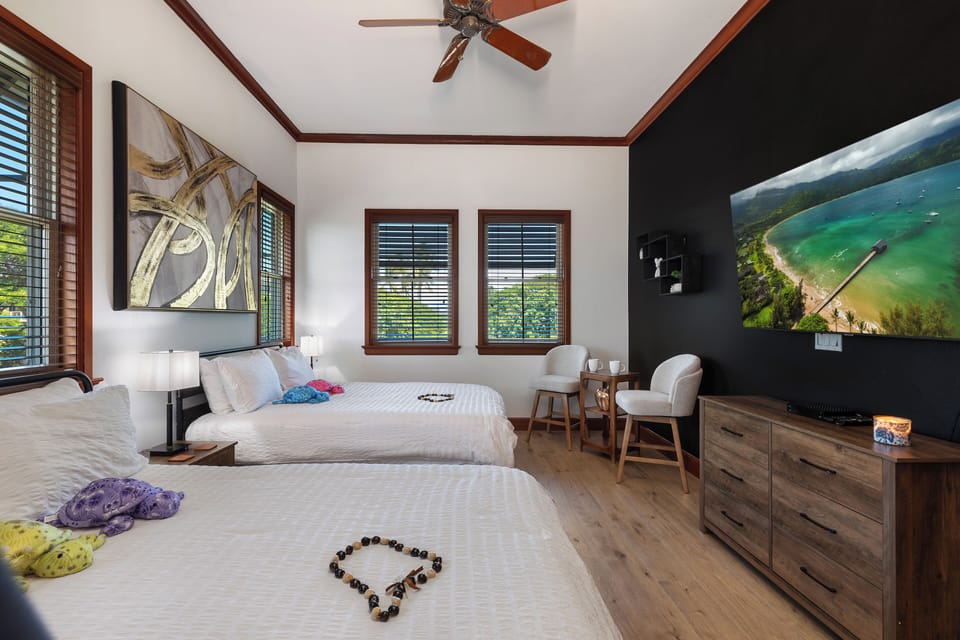 Bedroom with two Full Beds and Smart TV.
