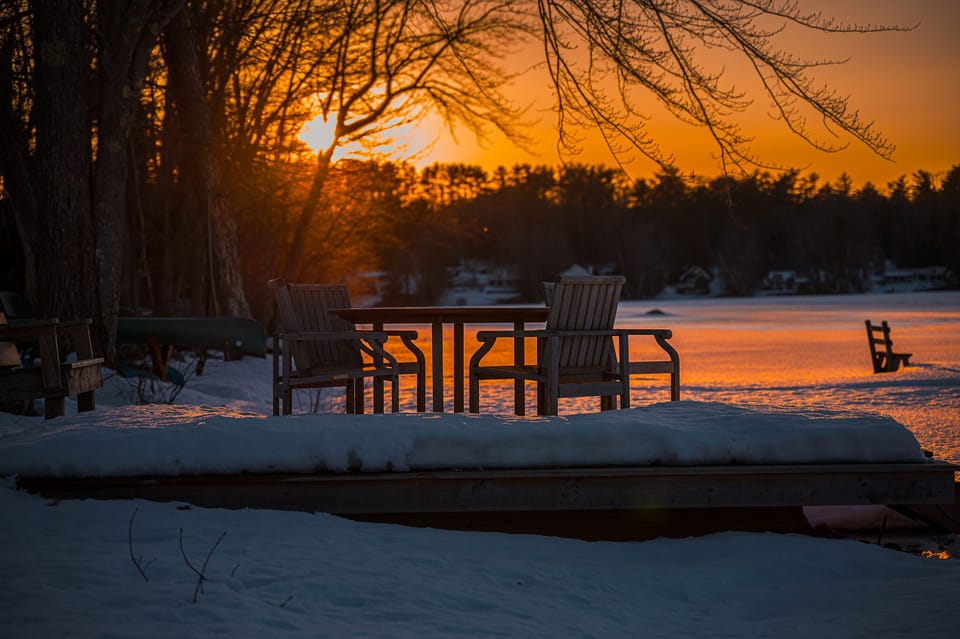 Winter sunset on the waterfront deck.