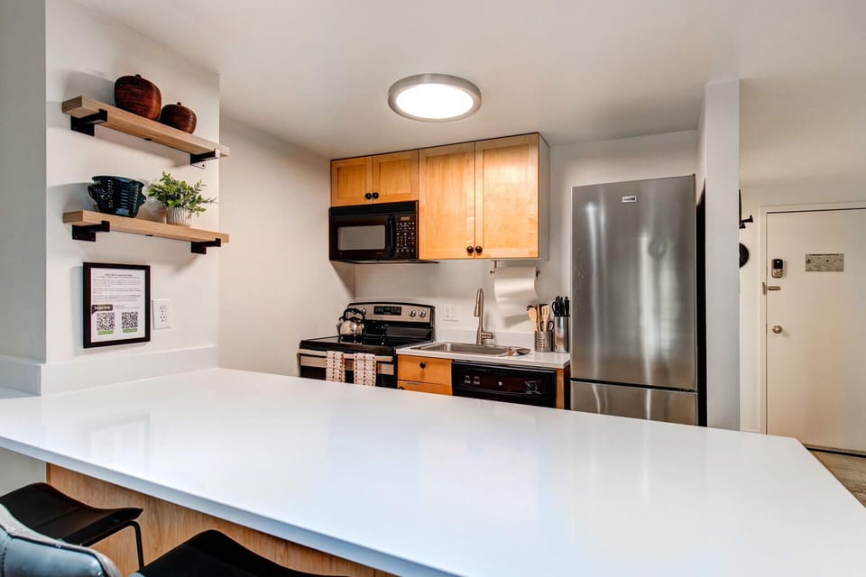 Edelweiss Haus A102: Kitchen - fully-equipped with countertop seating