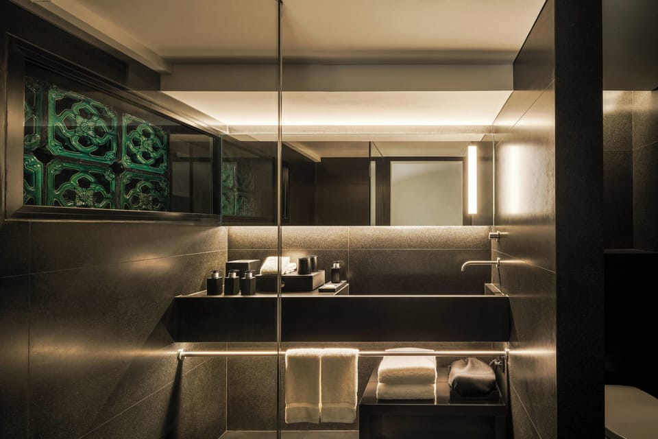 Designer toiletries, hair dryer, bathrobes, towels