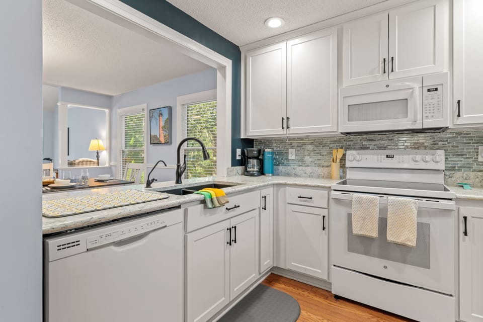 Kitchen has plenty of workspace for the chef in your group