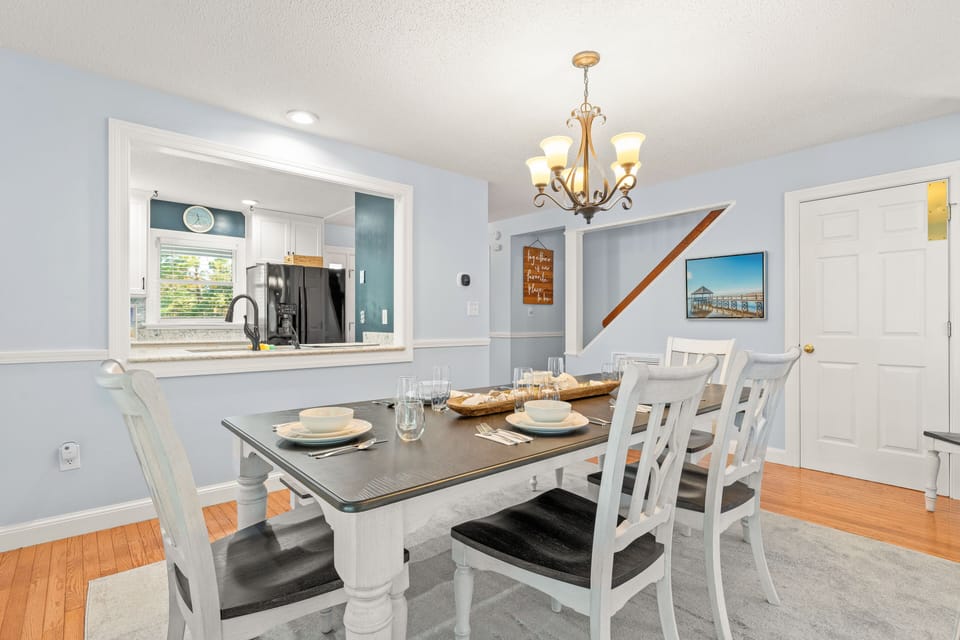Dining area looking into kitchen; stairs to the back right lead to second level