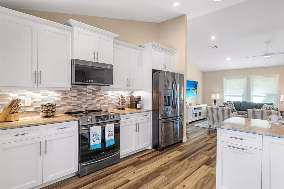 The fully-equipped kitchen with stainless steel appliances