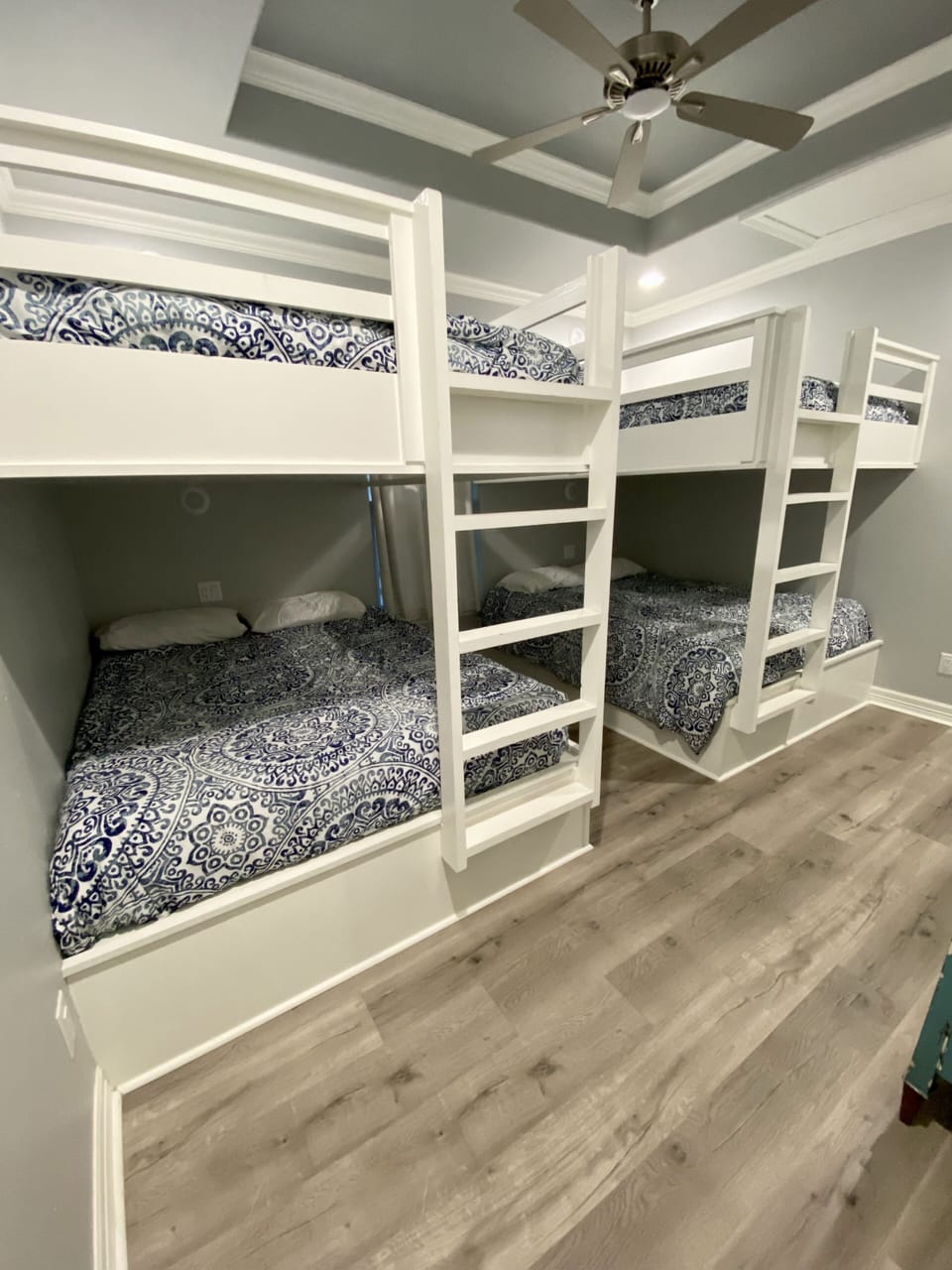 Another view of the bunk room with 4 queen beds.