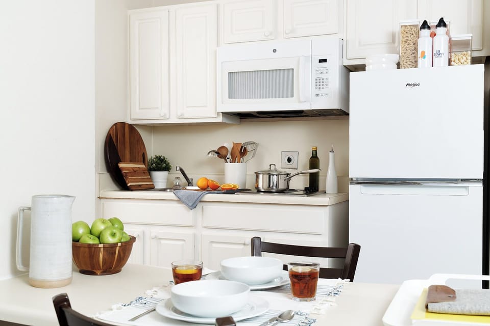 Fridge, microwave, stovetop, dining tables
