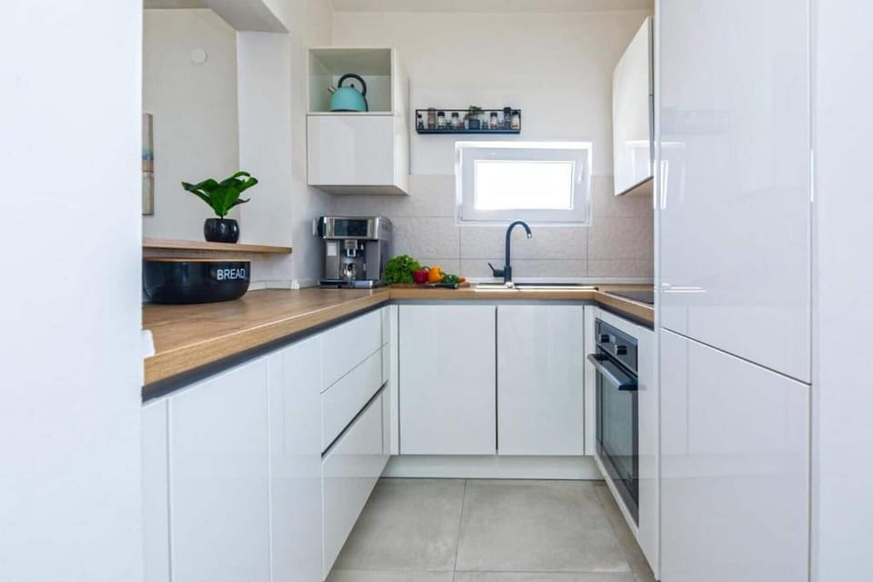 Villa | Private kitchen | Fridge, oven, stovetop, dishwasher