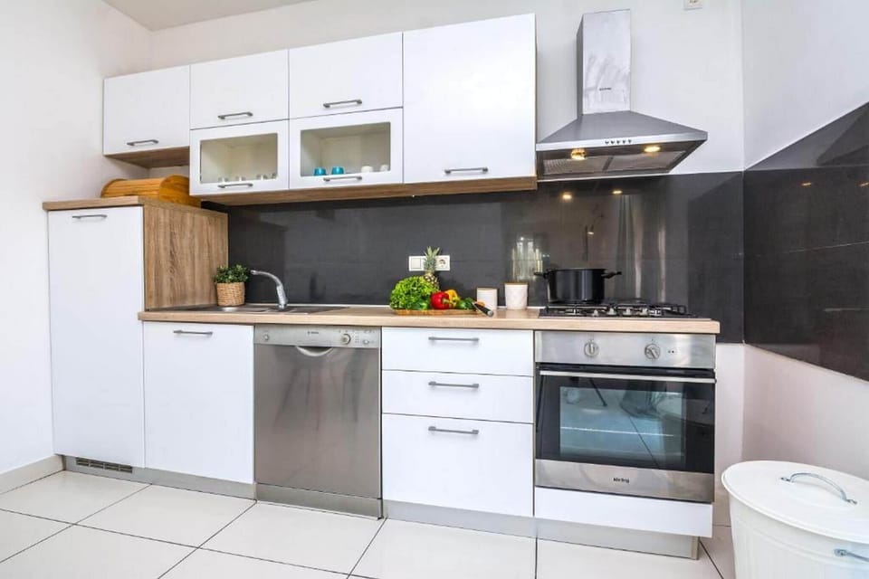 Villa | Private kitchen | Fridge, oven, stovetop, dishwasher
