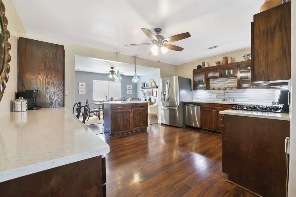 You'll love preparing meals in this kitchen with ample counter space and the island overlooking the dining area.