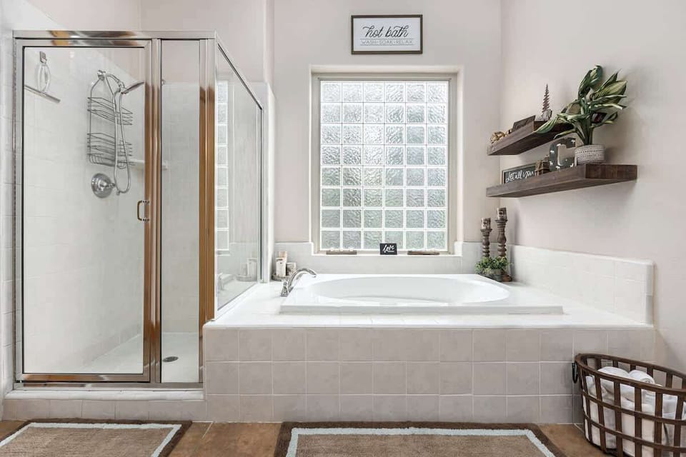 Master bathroom with a soak bathtub and a stand alone shower!