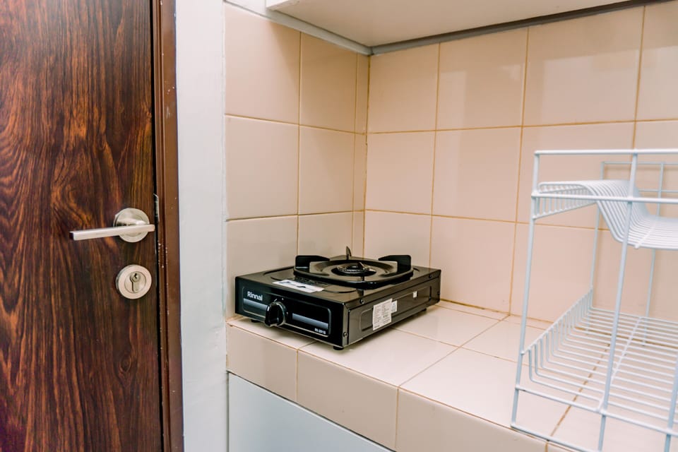 Studio | Private kitchen | Fridge, stovetop, cookware/dishes/utensils, dining tables