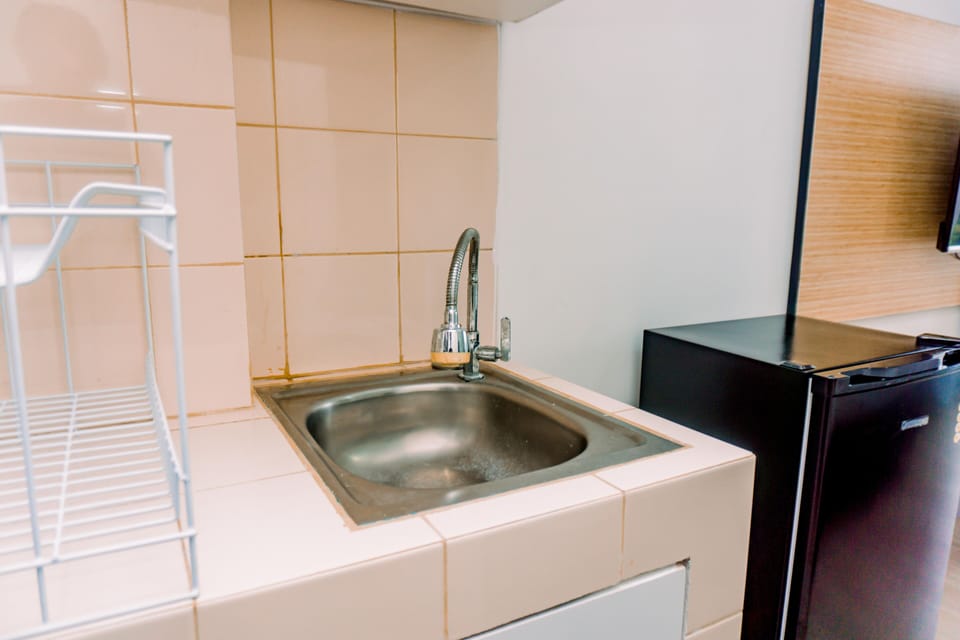 Studio | Private kitchen | Fridge, stovetop, cookware/dishes/utensils, dining tables