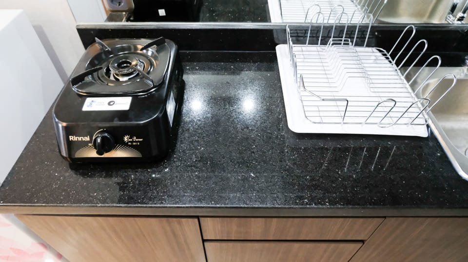 Studio | Private kitchen | Fridge, stovetop, cookware/dishes/utensils, dining tables