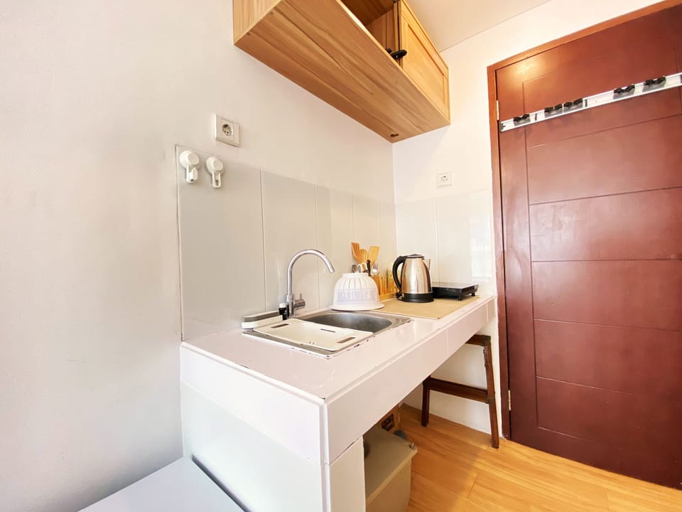 Studio | Private kitchen | Fridge, stovetop, cookware/dishes/utensils, dining tables