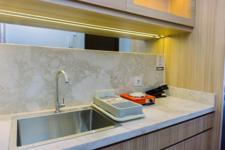 Studio | Private kitchen | Fridge, stovetop, cookware/dishes/utensils, dining tables