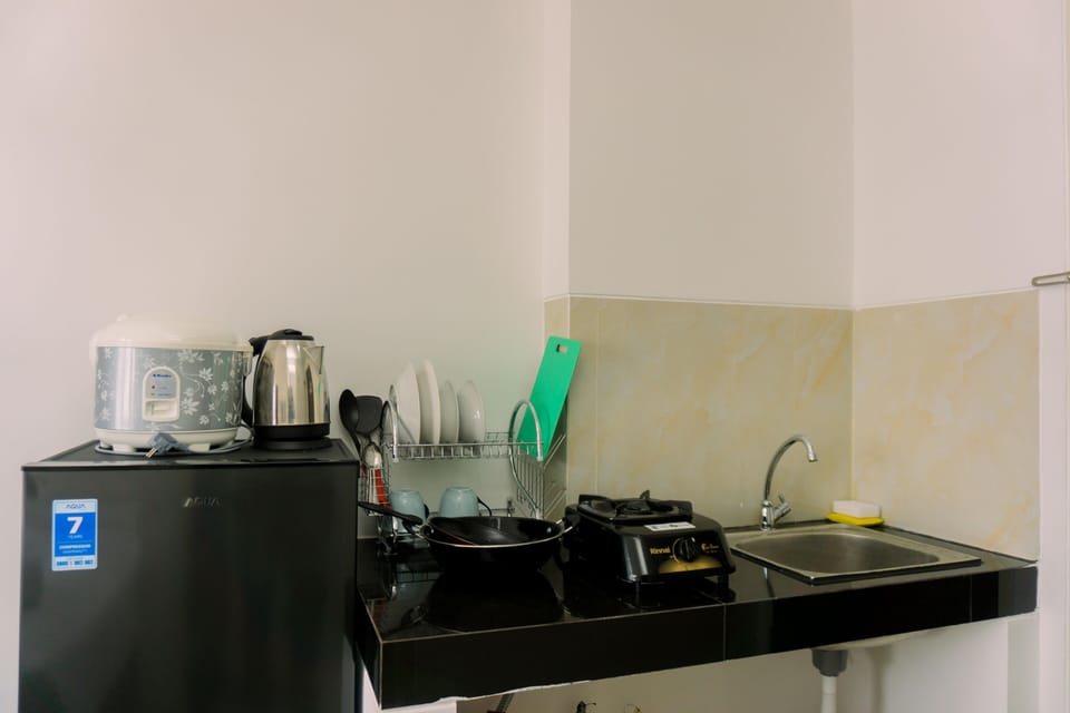 Studio | Private kitchen | Fridge, stovetop, cookware/dishes/utensils, dining tables