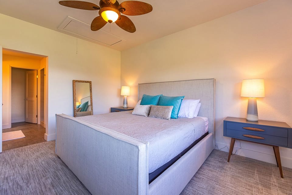 Spacious primary bedroom features a king bed.