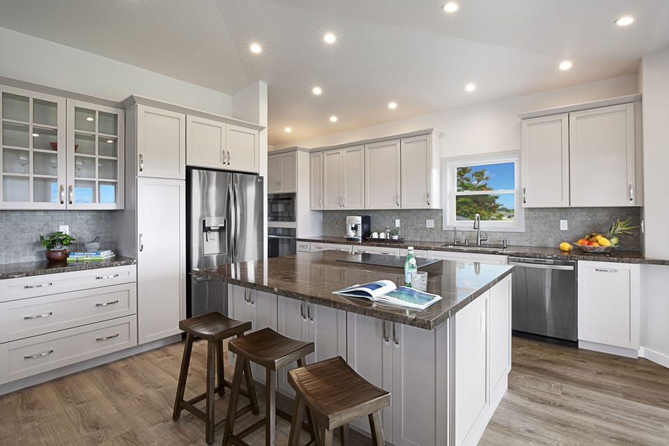 Modern kitchen with sleek appliances and a functional layout, perfect for preparing meals with ease.