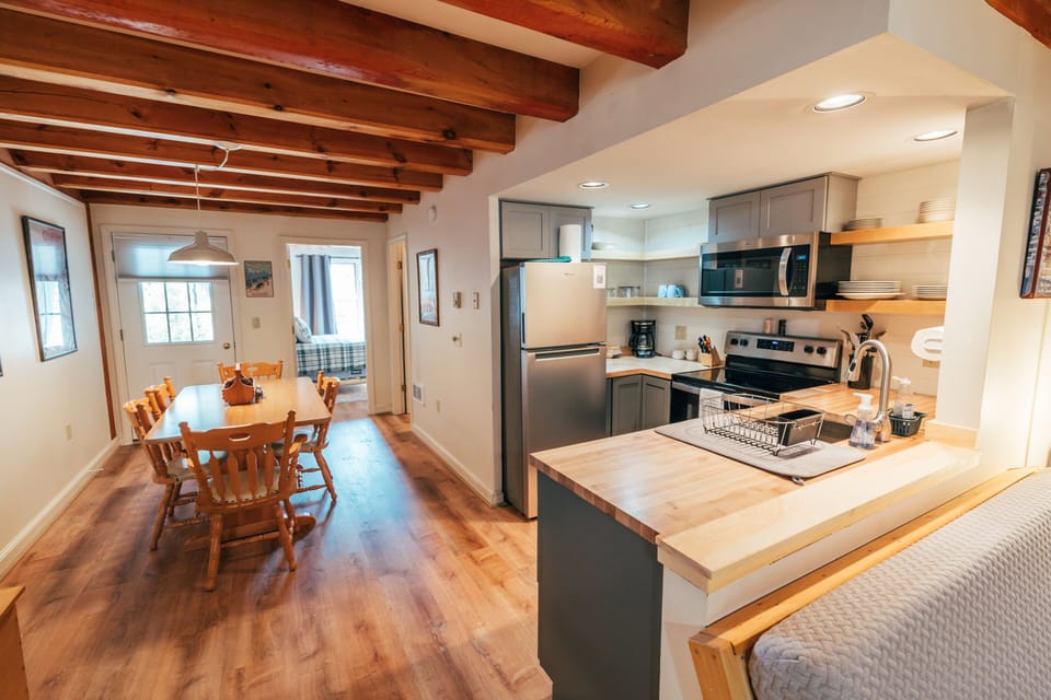 Open concept living area, kitchen and dining.