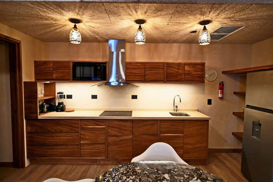 Full practical kitchen at second floor  in an open area with the dining room