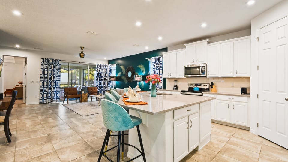 Sit up at the breakfast bar and keep the chef company
