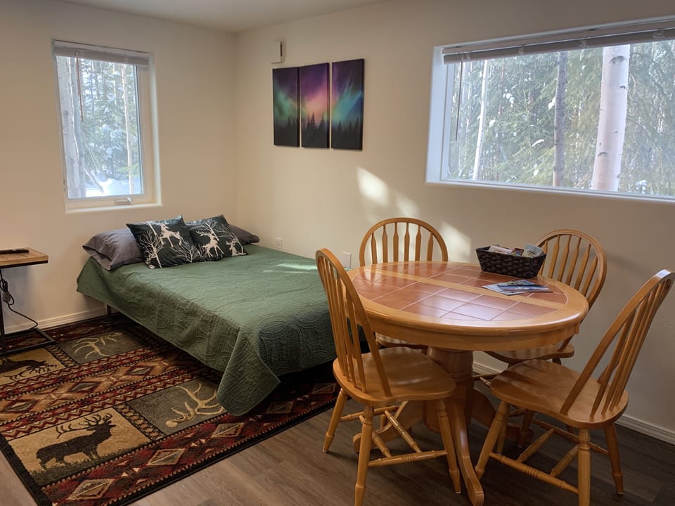 Futon in living area converts to a full size bed.