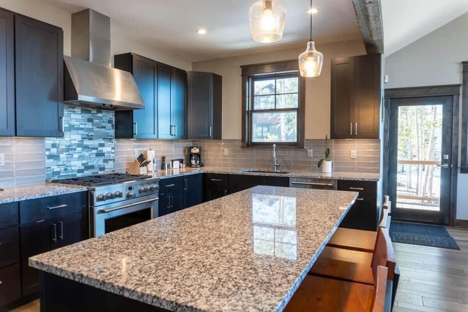 The fully-equipped kitchen is a beautiful space to put together a delicious meal and includes a large kitchen island with 4 bar stools for additional seating.