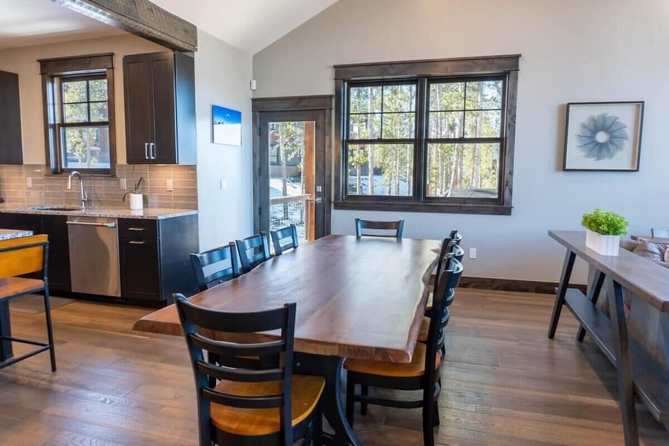 Connected to the living room is the dining area which features a beautiful wood dining table set with seating for 8.
