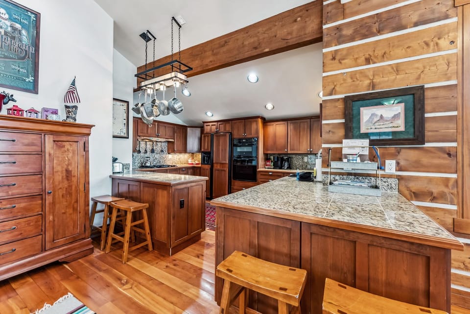 Kitchen: Drip coffee maker, Keurig coffee maker, wine fridge, blender, cooking utensils, tableware