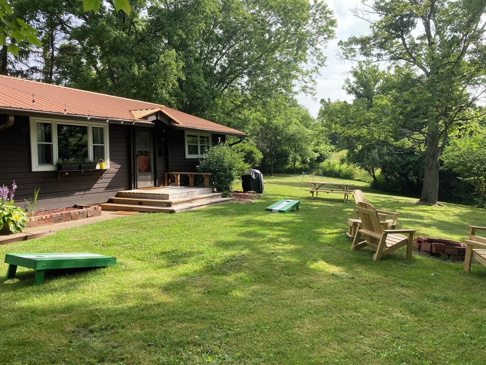 Large private yard with games, firepit, table & grill