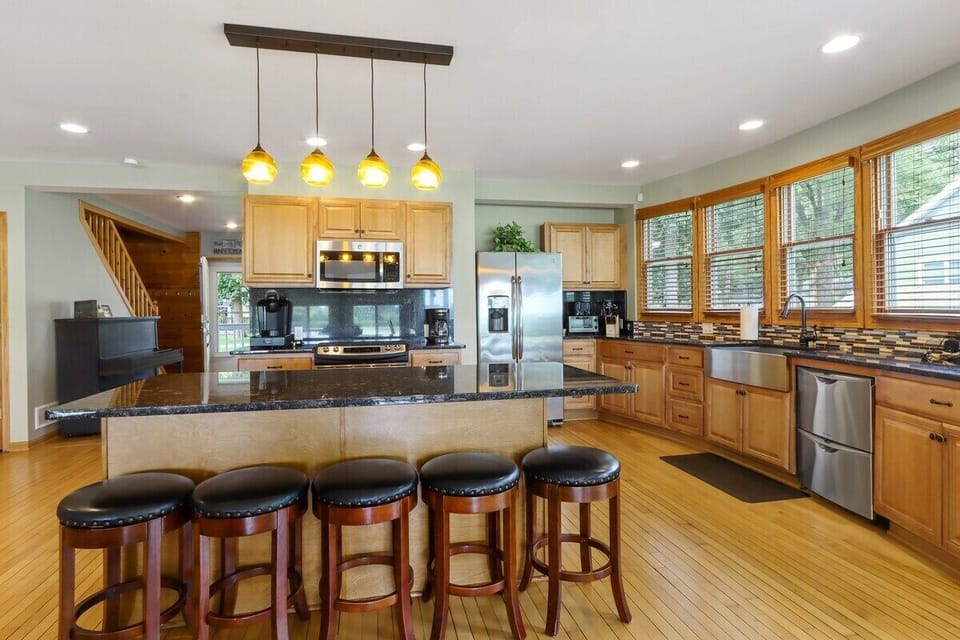 Open concept kitchen with breakfast bar seating for 5