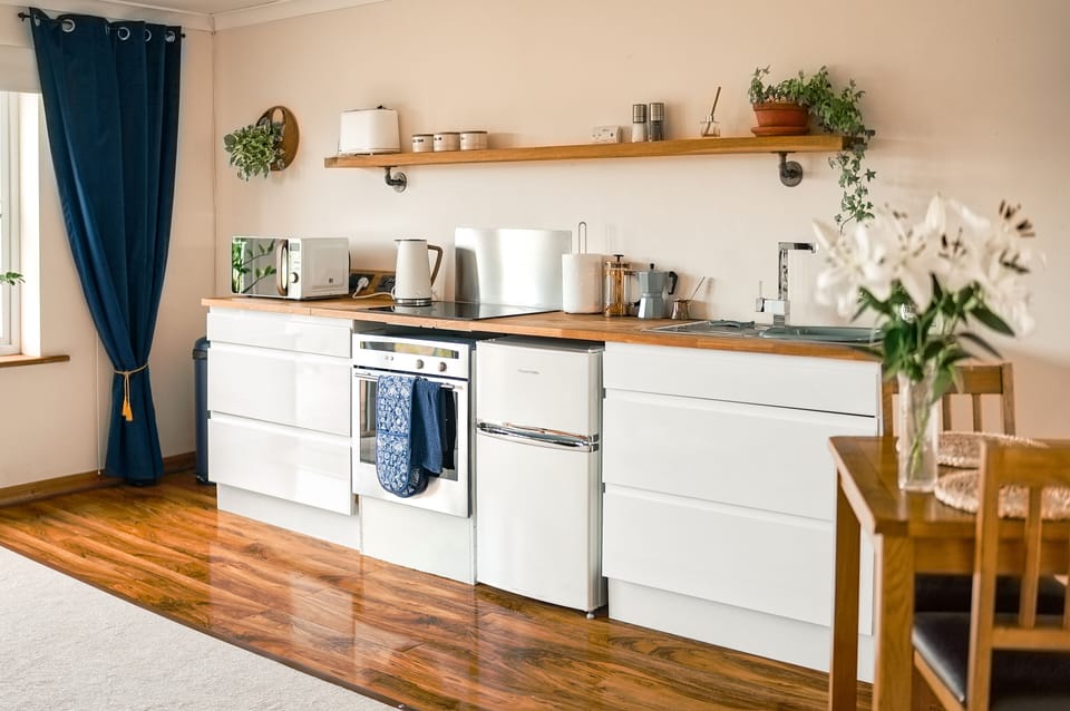 Cook up a tasty meal together in the spacious, fully-equipped kitchen.