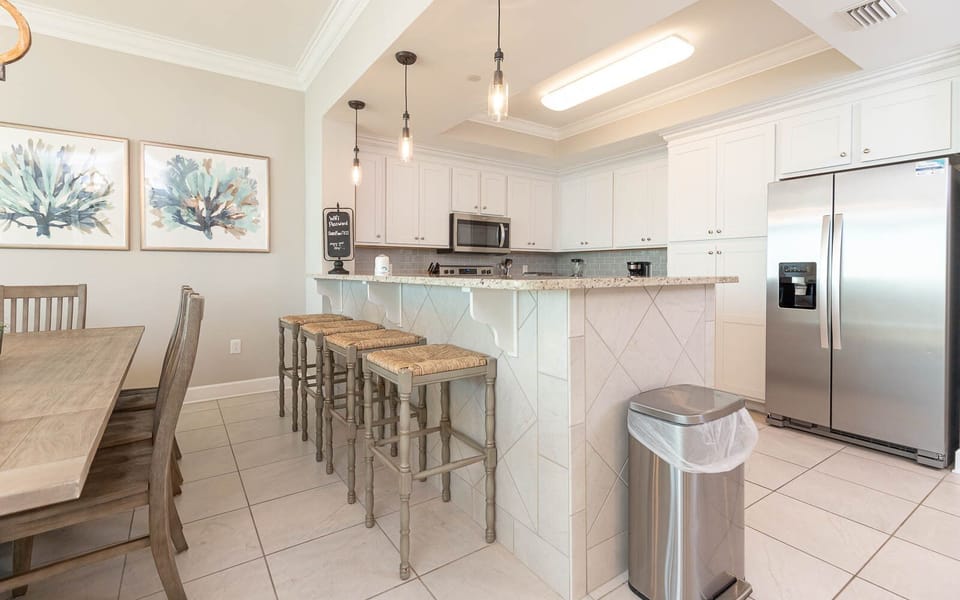 Enjoy casual chats at the breakfast bar while sipping coffee, immersed in relaxing beach vibes