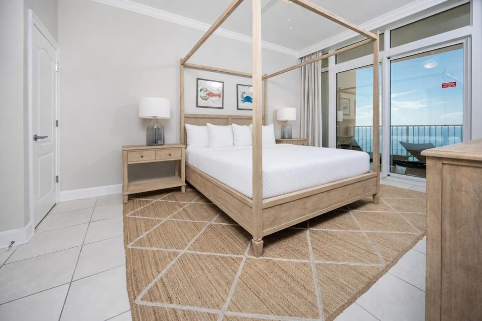 Retreat to the king master suite with cozy bedding and drift off to the sound of the waves from the balcony