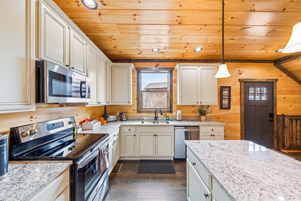 Fully stocked kitchen w/ stainless steel appliances.