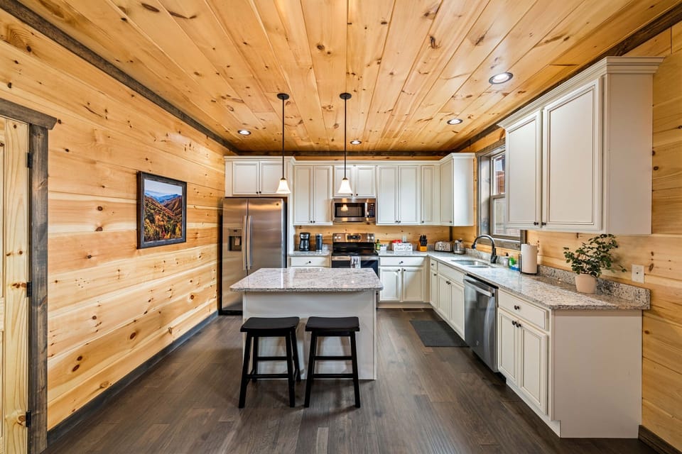 Fully stocked kitchen w/ stainless steel appliances.