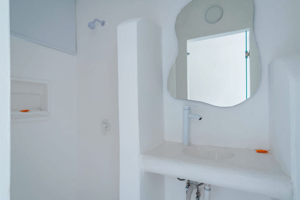 Shower, rainfall showerhead, towels, soap